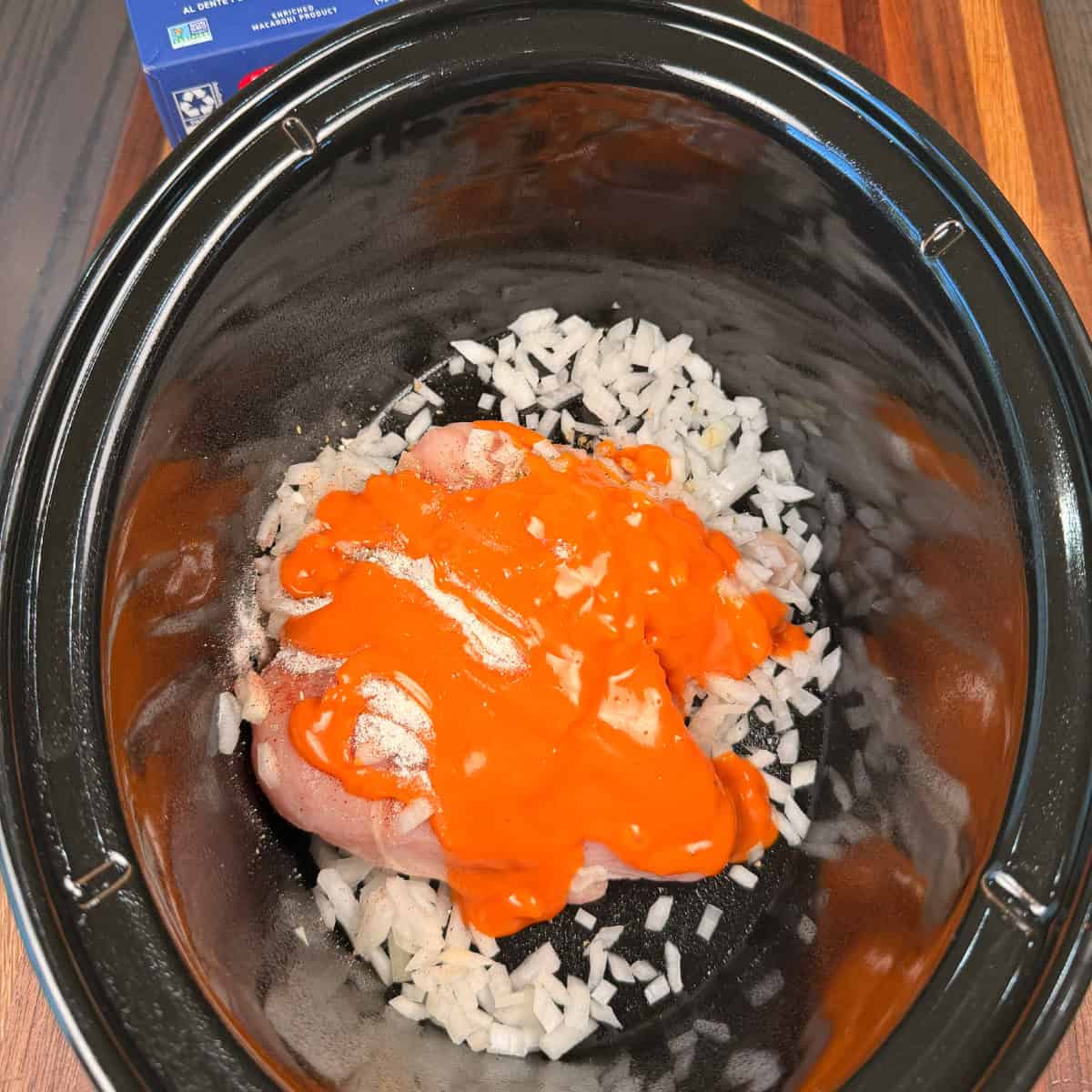 Chicken, seasonings, onion, and Buffalo sauce