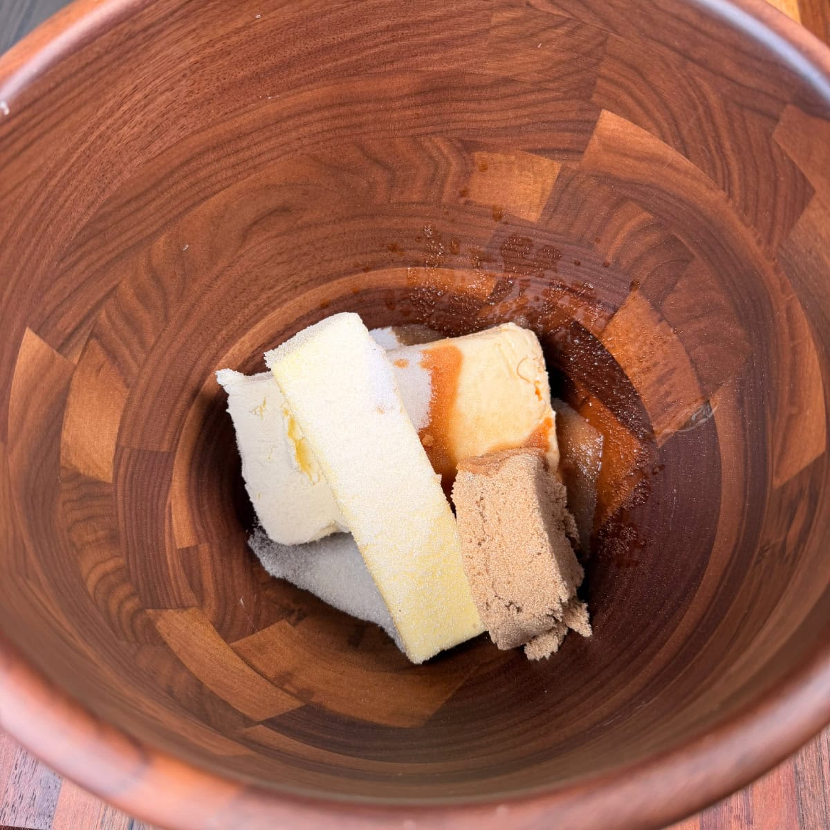cream cheese, butter, brown sugar, sugar in mixing bowl