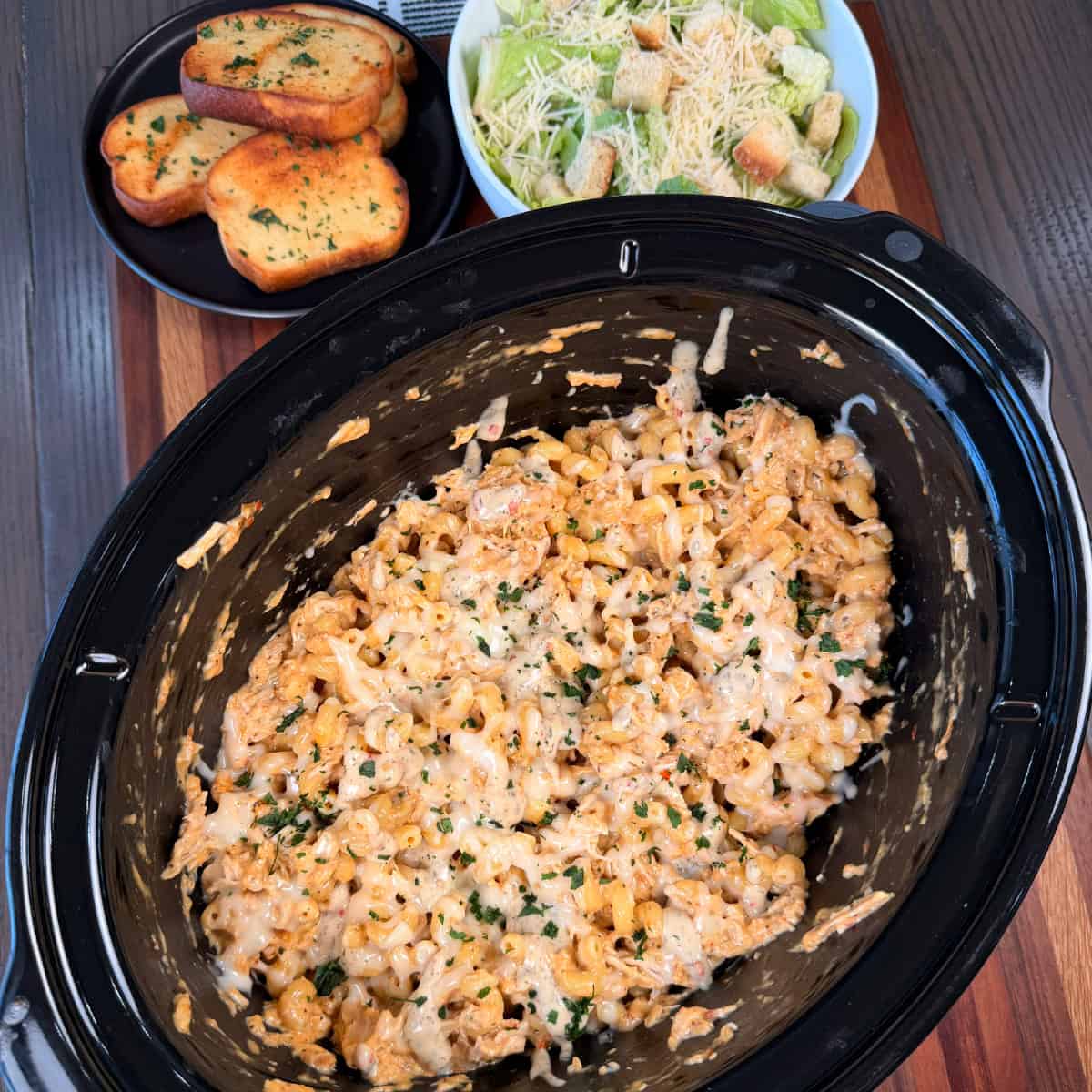 Crockpot Garlic Parmesan Chicken Pasta with salad and garlic toast