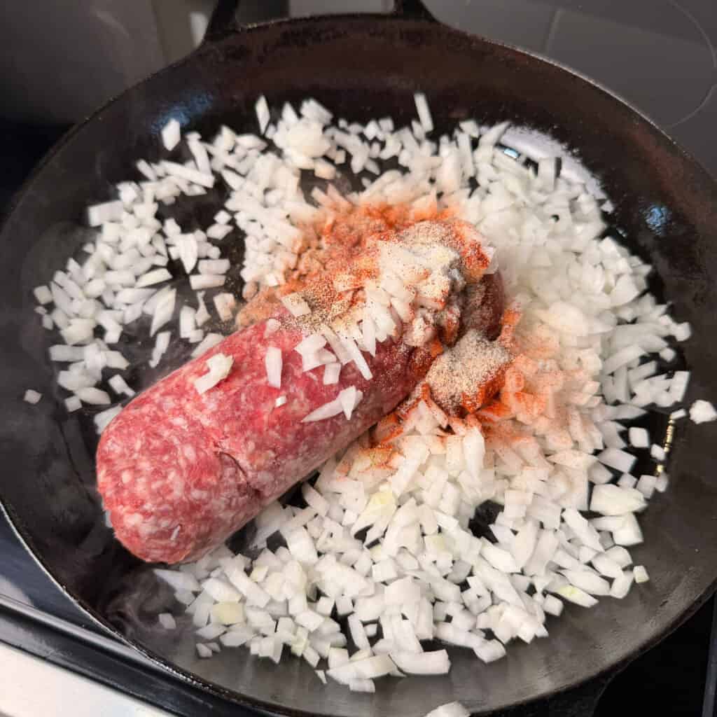 Ground beef, onions, seasonings in skillet