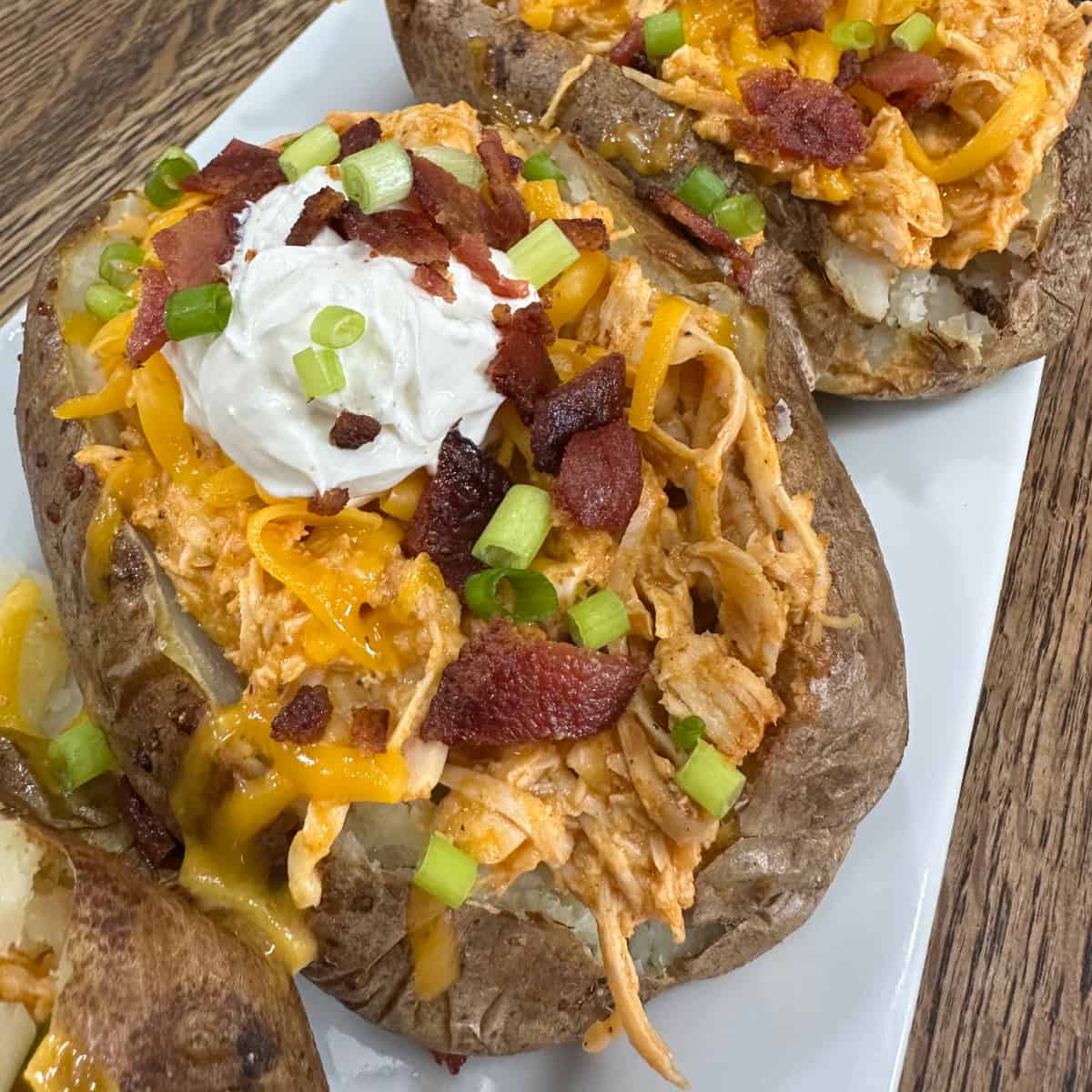 Crockpot Buffalo Chicken Baked Potatoes - Cooking in the Midwest