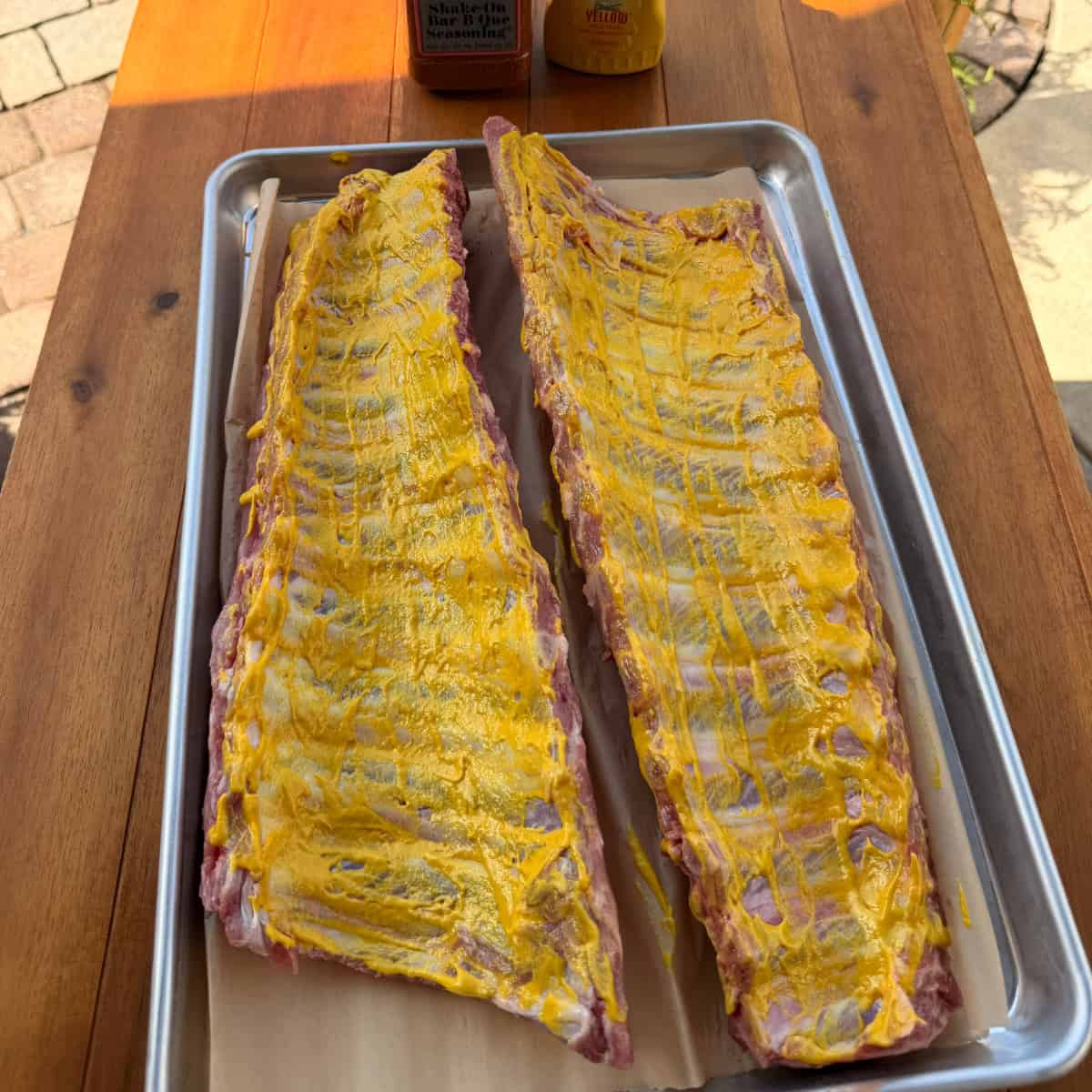 Baby Back Ribs coated in yellow mustard