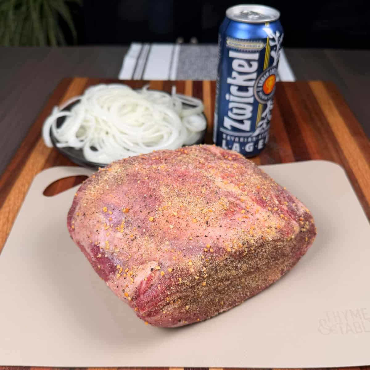 Chuck Roast seasoned with salt pepper and garlic powder with sliced onions and beer 