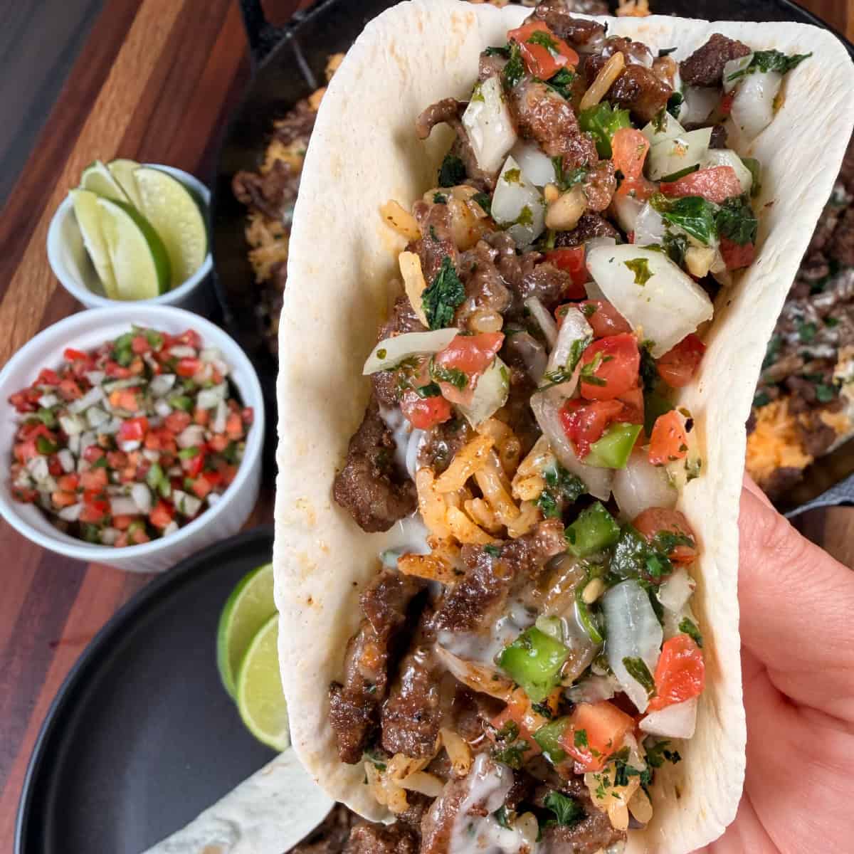 Steak Cheese and Rice in flour tortilla and topped with Pico de Gallo