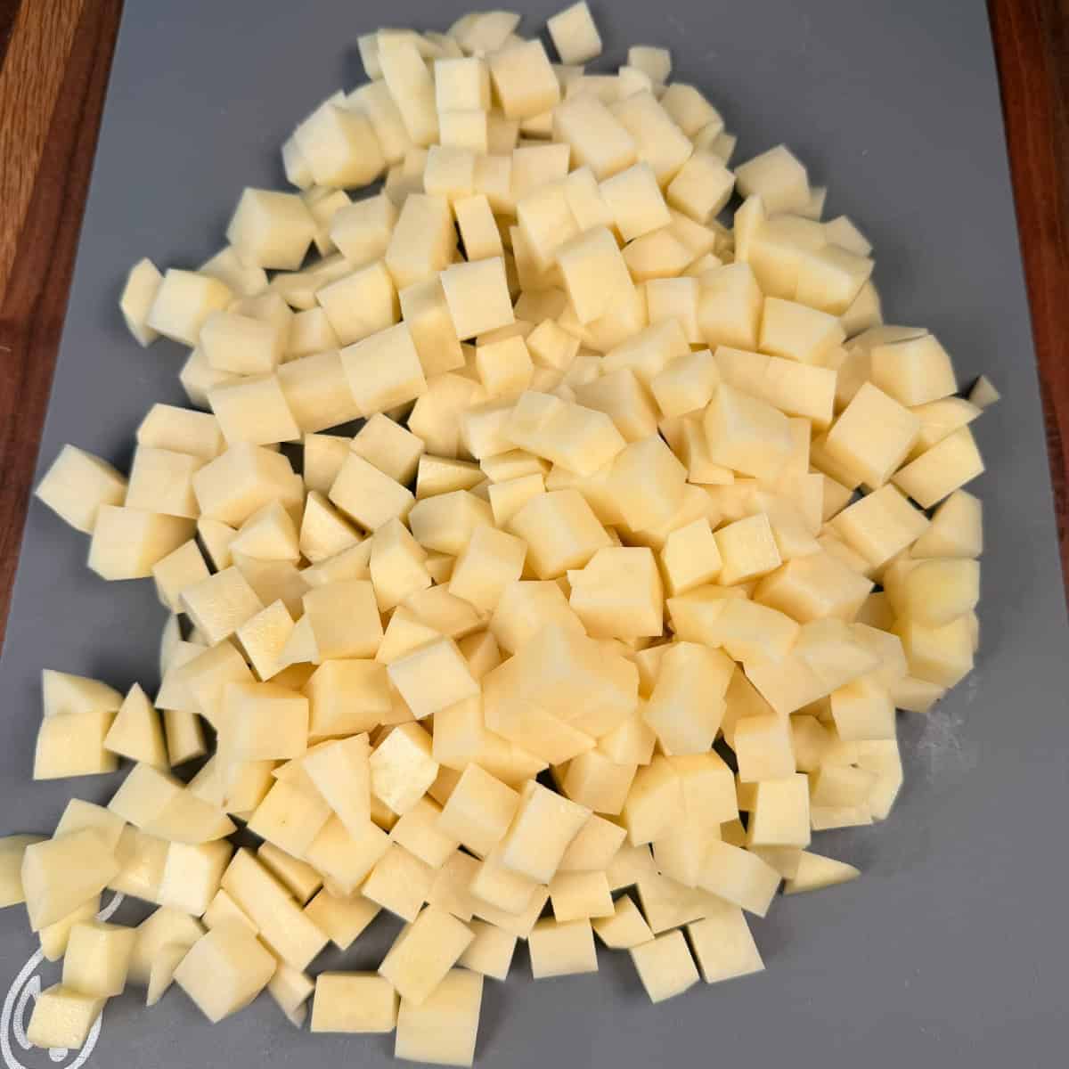 Chopped russet potatoes on cutting board