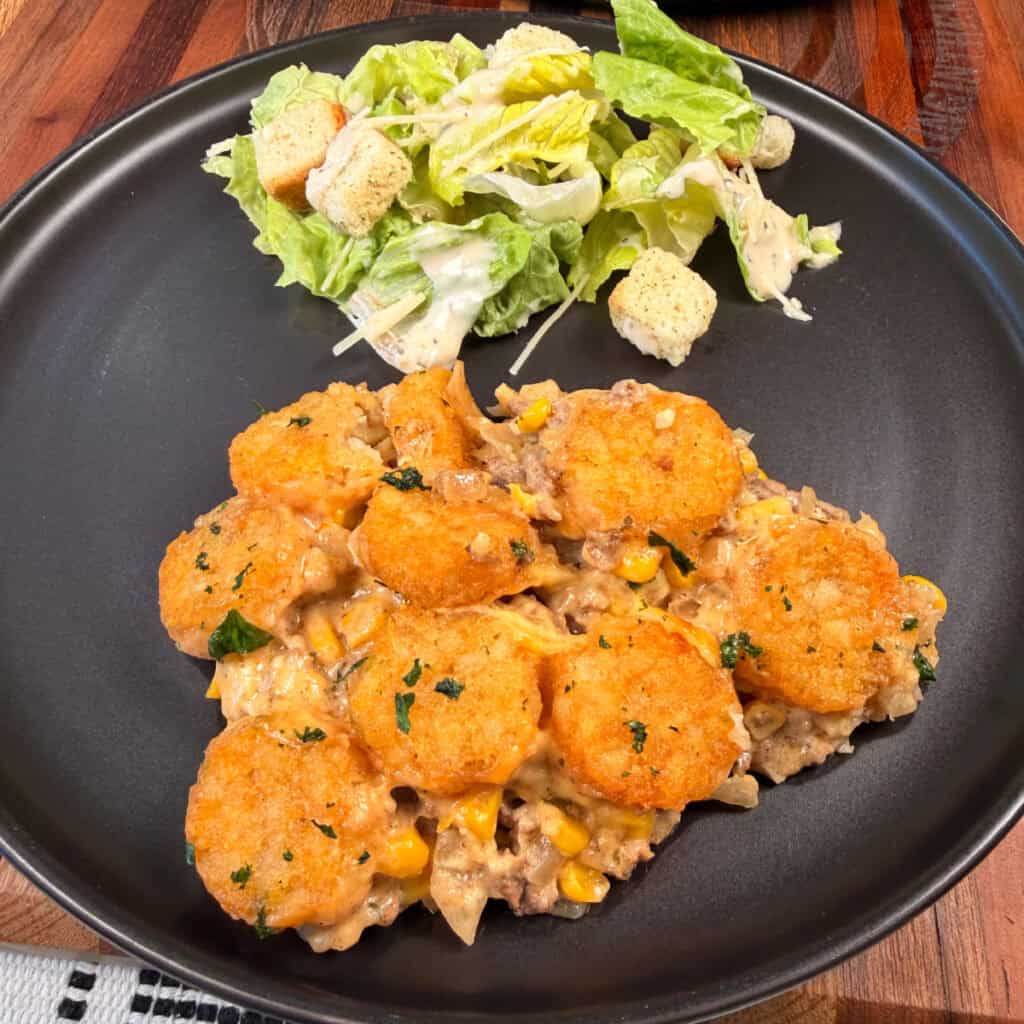 Plated Cowboy Casserole with salad