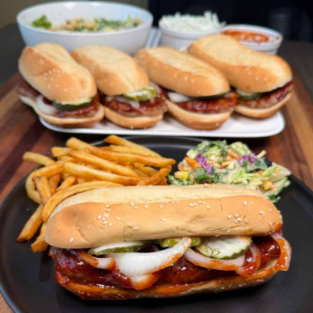 Plated Copycat Mcrib with fries and a salad