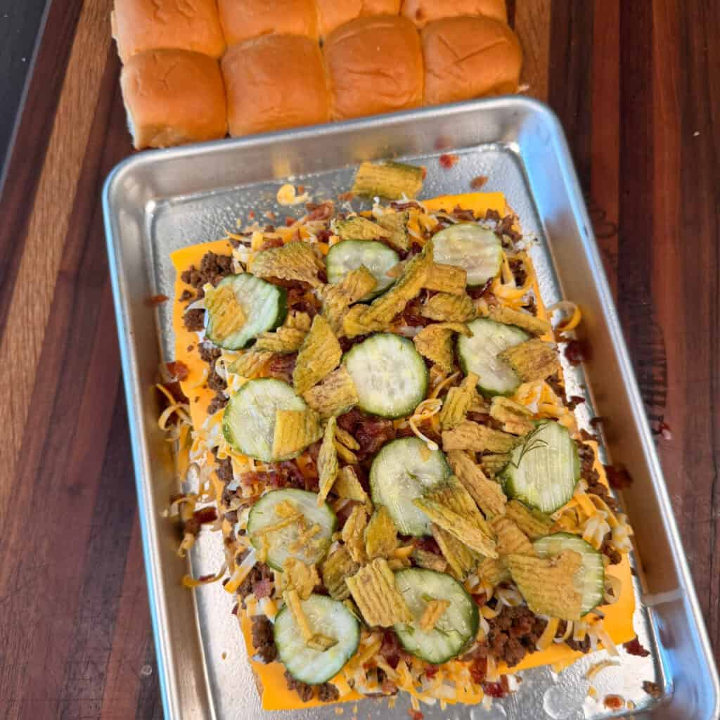 Ground beef sliders topped with pickles