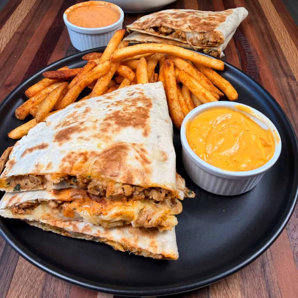 Plated Nacho Fries with quesadillas