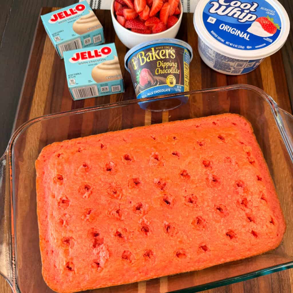 Strawberry Cake Baked with holes poked in it