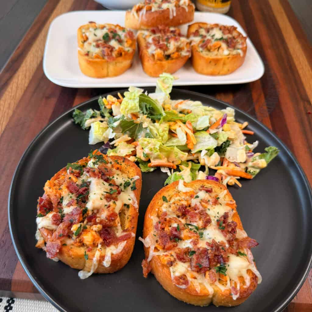 Plated Parmesan Garlic Chicken Garlic Toast with salad