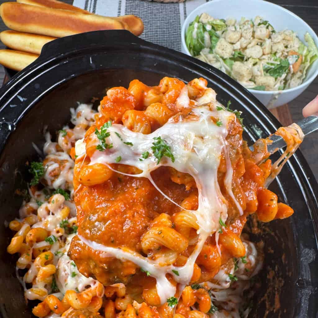 Scoop up photo of cheesy meatball pasta