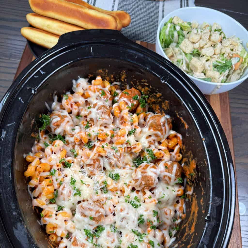 Crockpot Meatball Pasta with salad and bread sticks