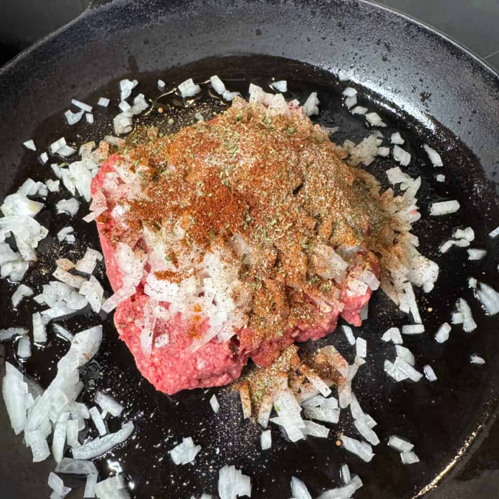 Cast iron skillet ground beef, seasonings, onions