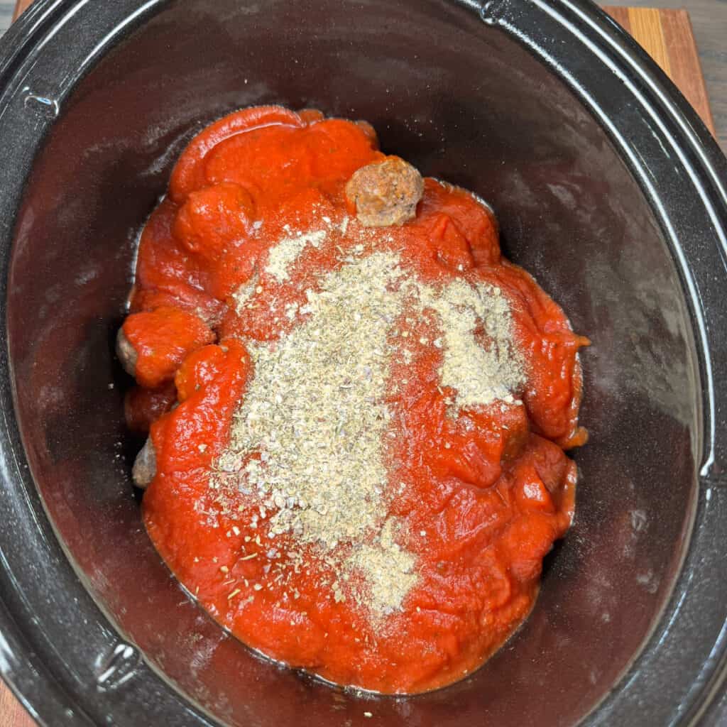 Crockpot of frozen meatballs, marinara sauce, and seasonings