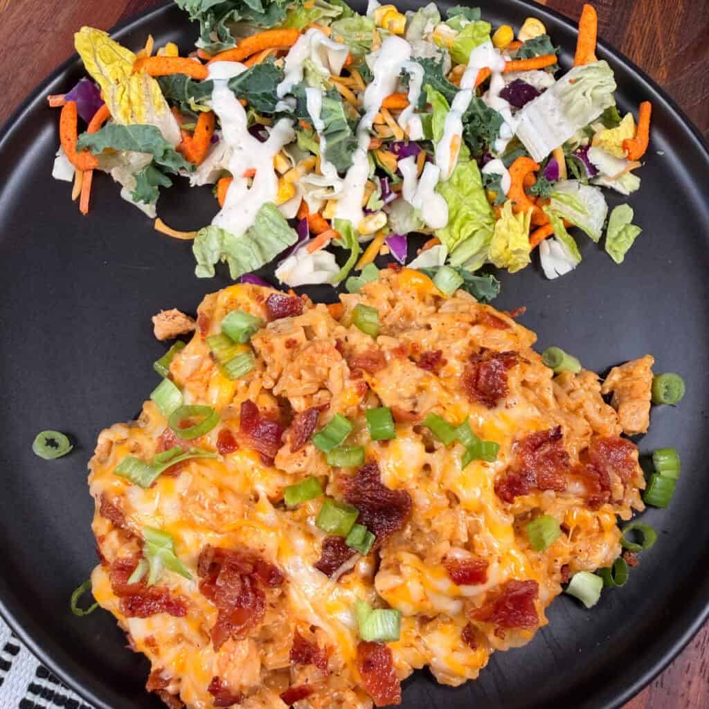 Plated Crack Chicken and Rice with salad