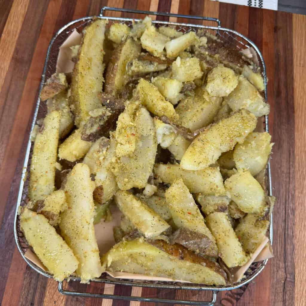 Seasoned Potato Wedges on Air Fryer Tray