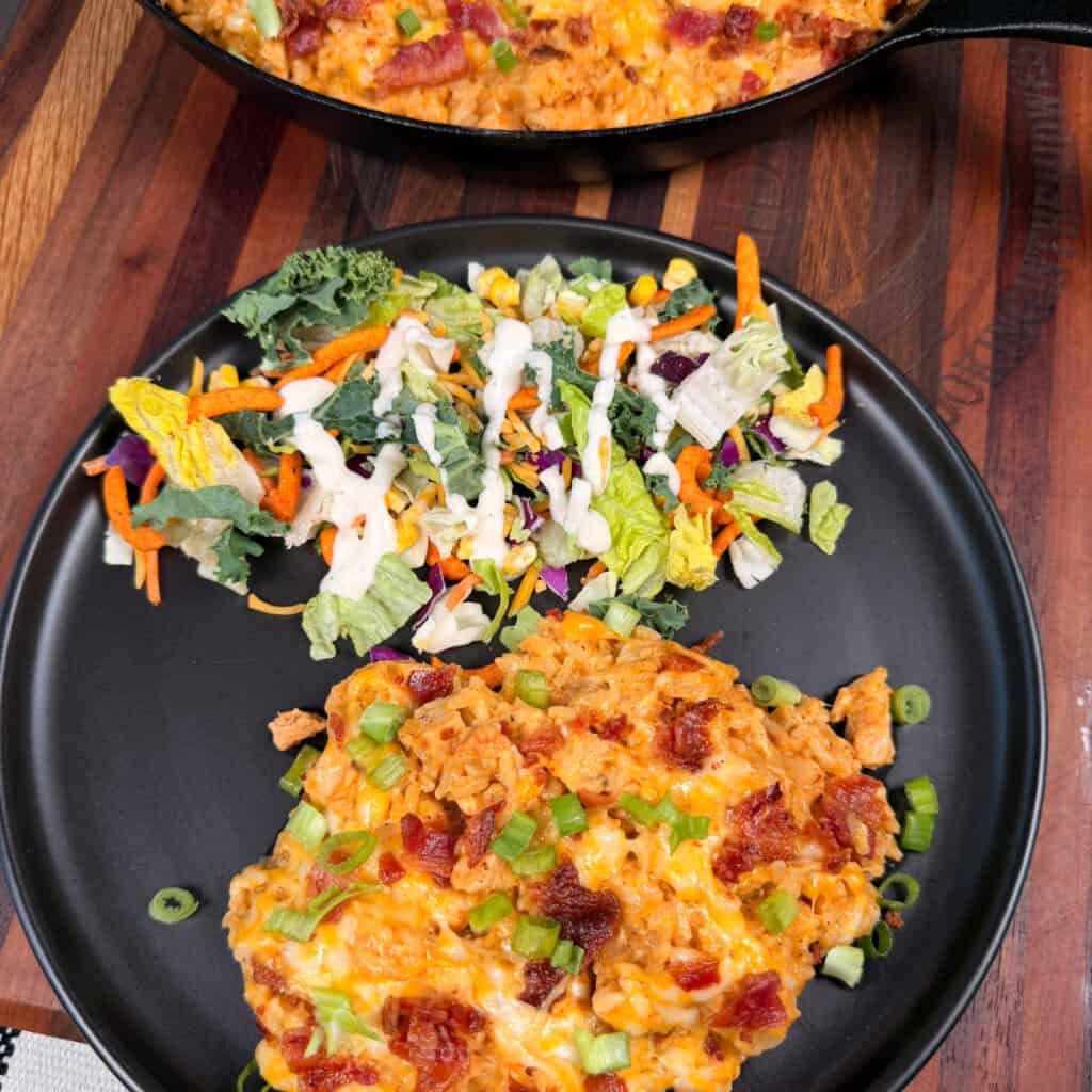 Plated Crack Chicken and Rice with salad