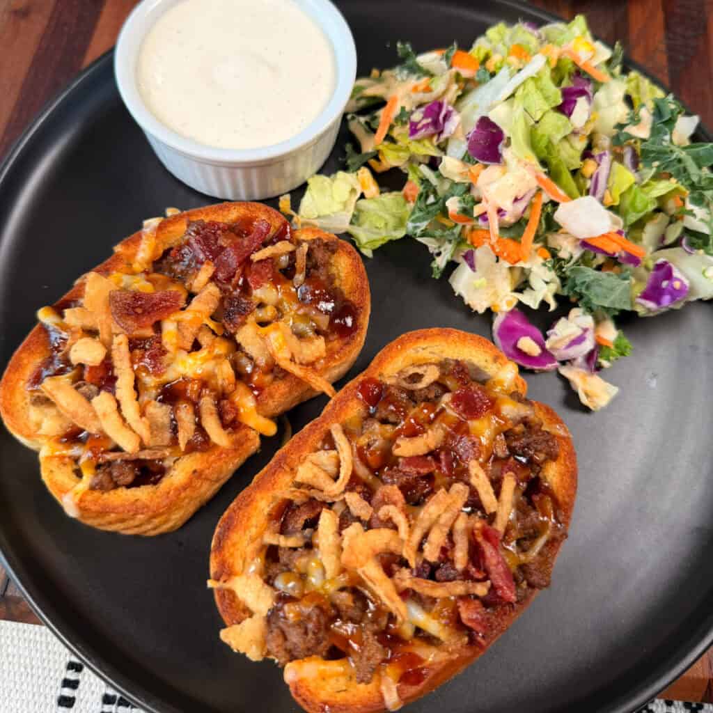 Plated BBQ Cheeseburger Garlic Toast with salad