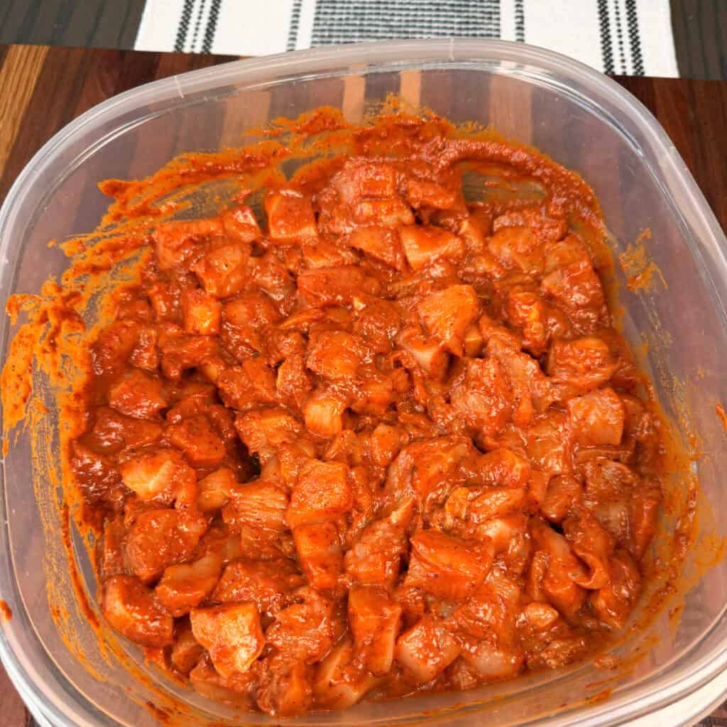 Marinated chicken in container