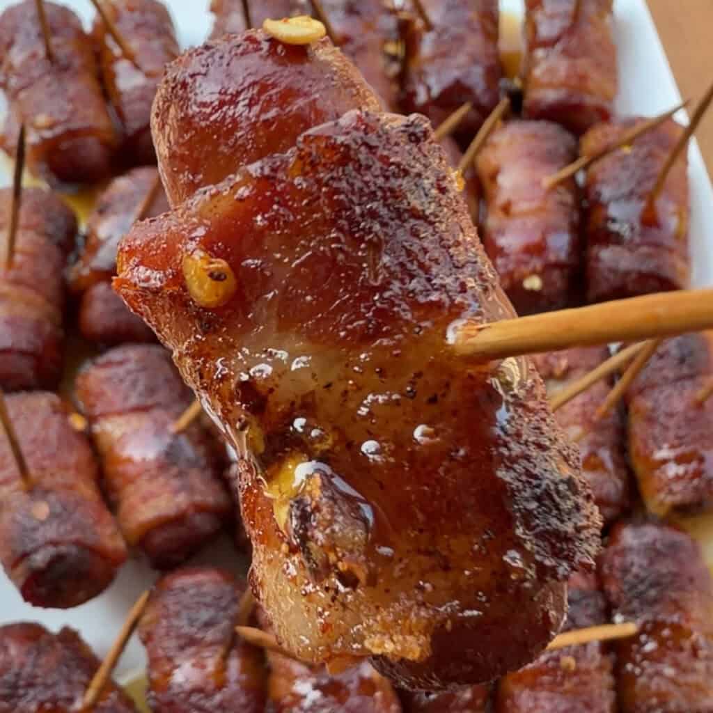 up close hot of bacon wrapped little smokies