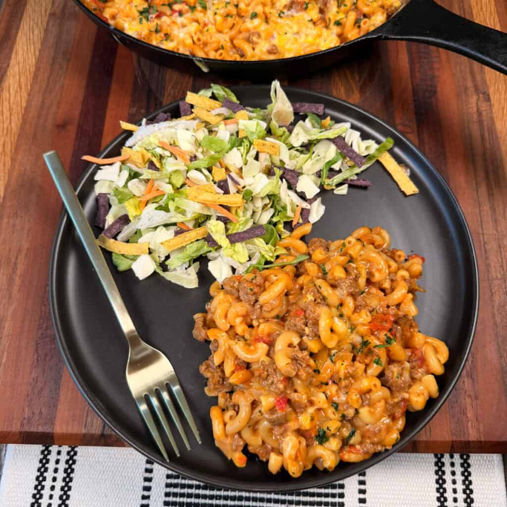 Plated One Pan Cheesy Taco Mac with salad