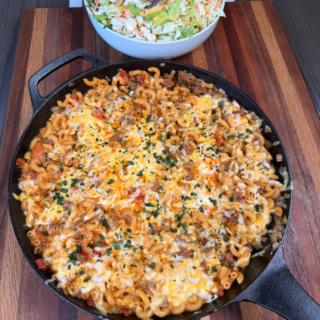 One Pan Cheesy Taco Mac with bowl of salad