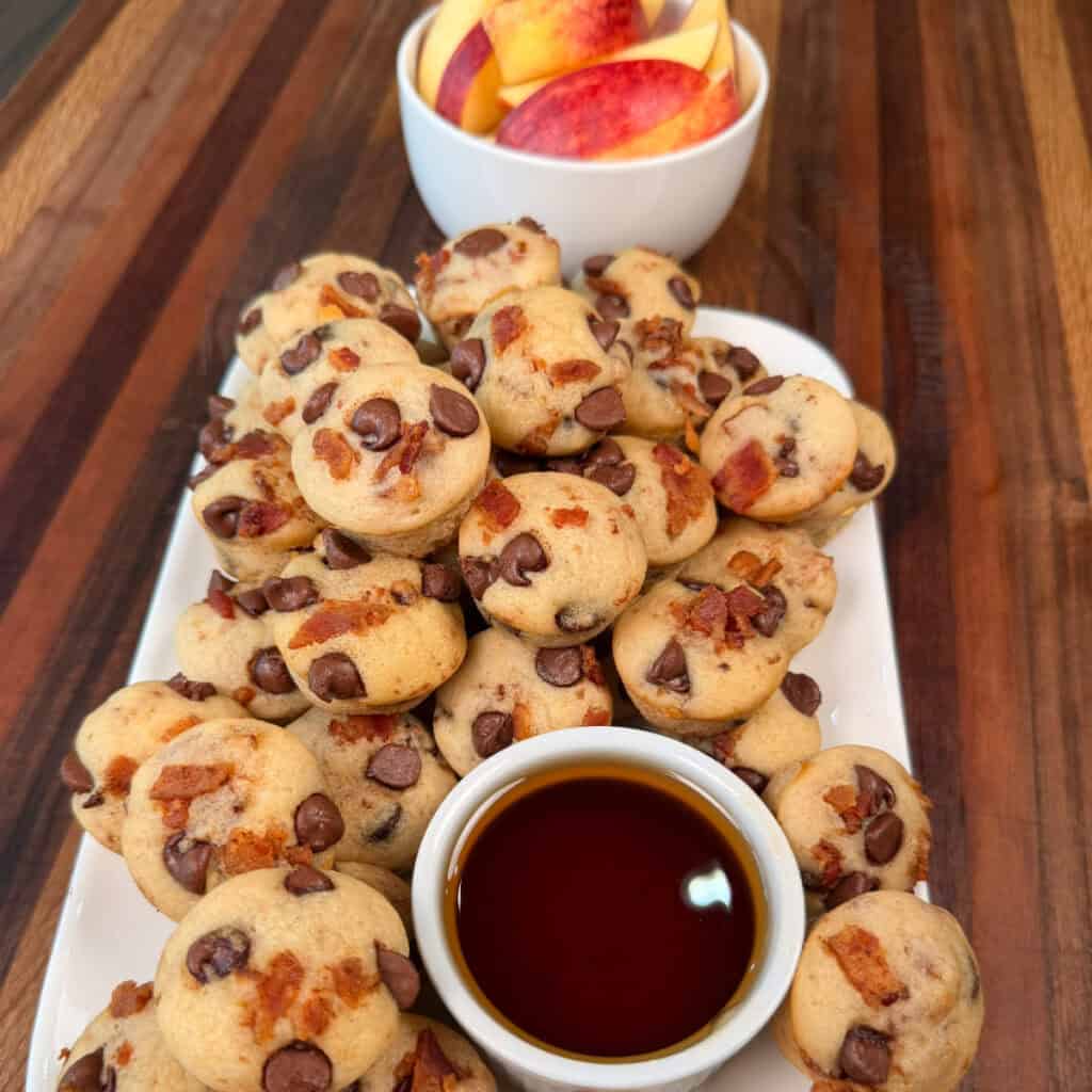 Mini chocolate chip pancake bites with syrup and apples