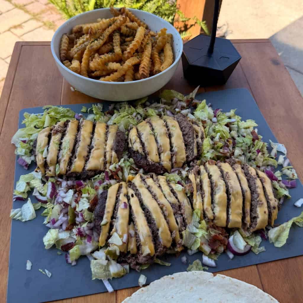 Chopped cheeseburgers, salad mixture, and fries