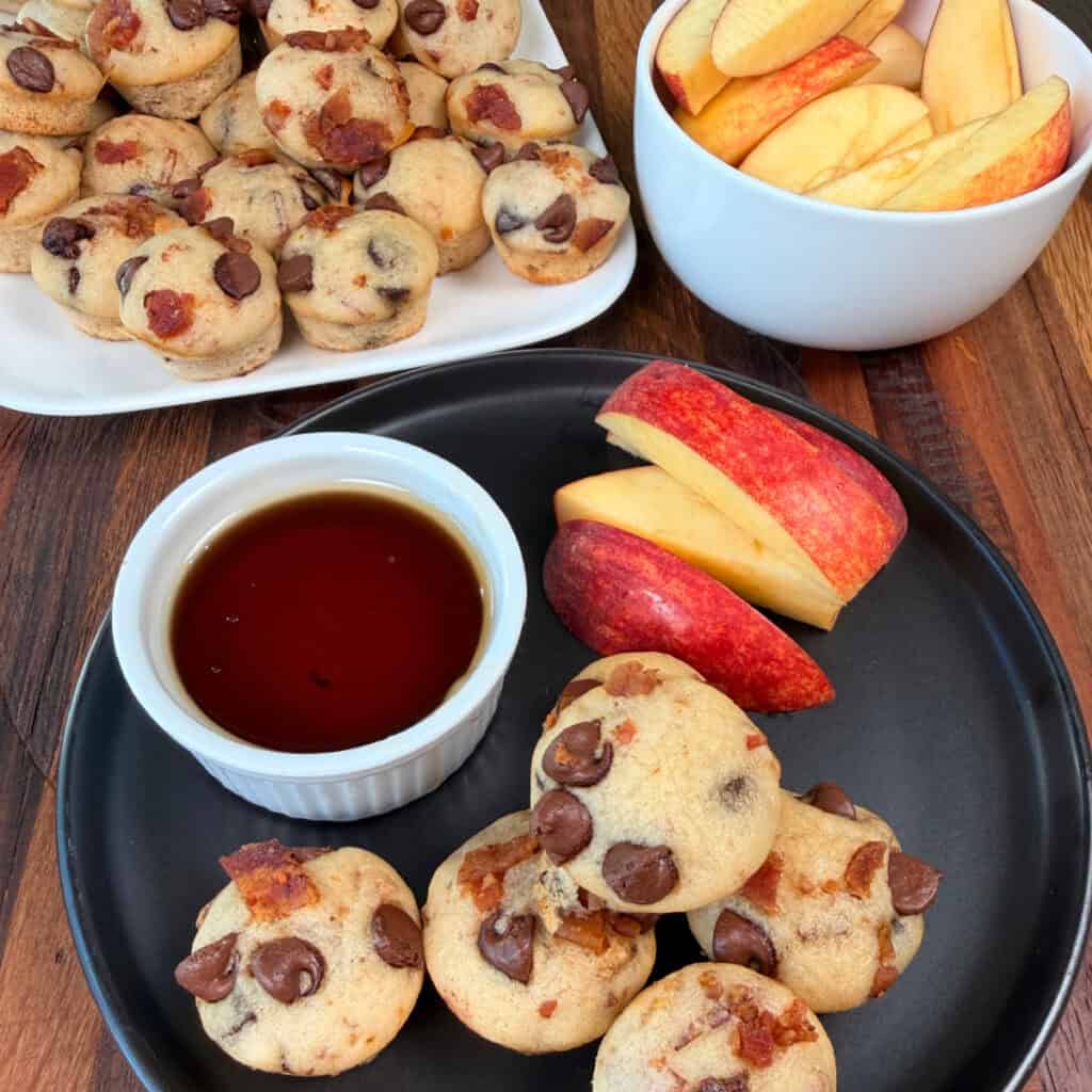 Plated mini pancake bites with syrup and apples