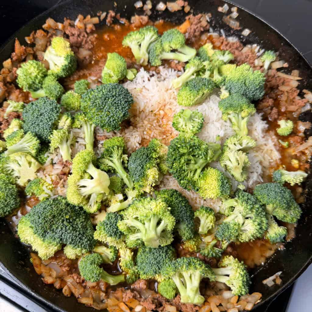Skillet with rice, broccoli, and broth added