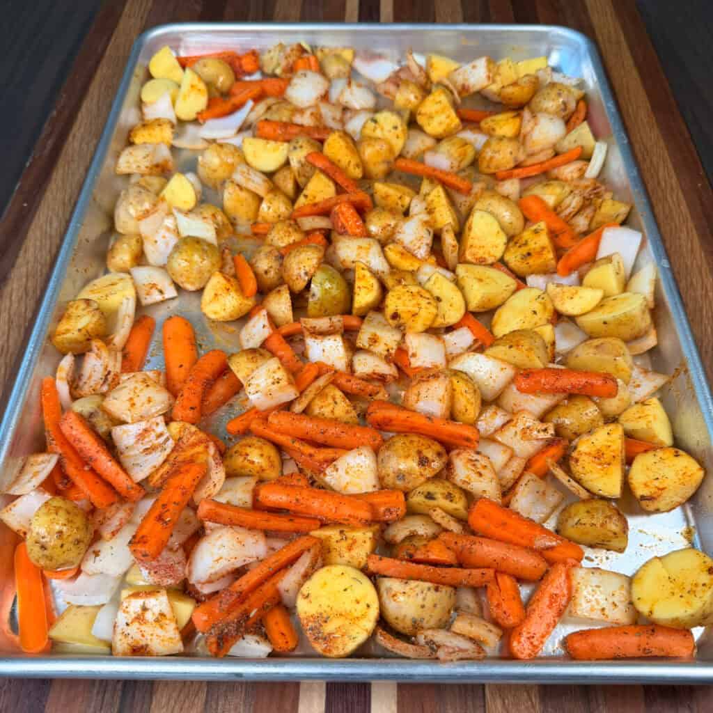 Sheet Pan with seasoned potatoes, onions, and carrots