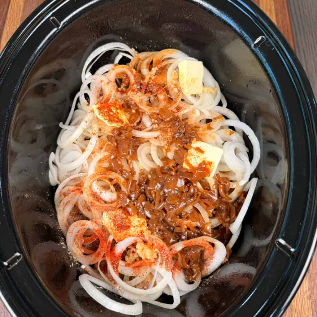Meatballs, onions, butter, seasonings, condensed French onion soup in crockpot
