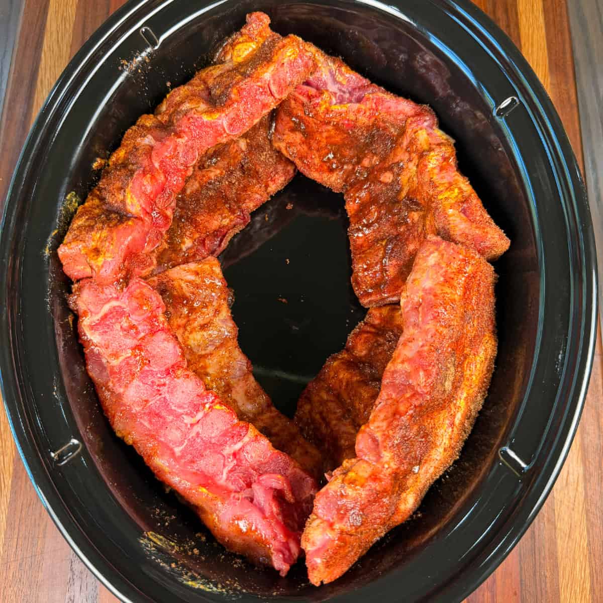 Baby Back Ribs cut and in crockpot ready to cook