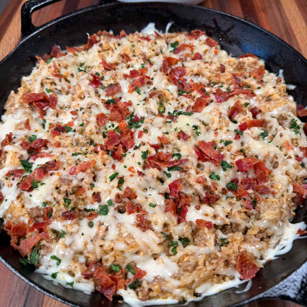 Parmesan Garlic Beef and Rice in cast iron skillet